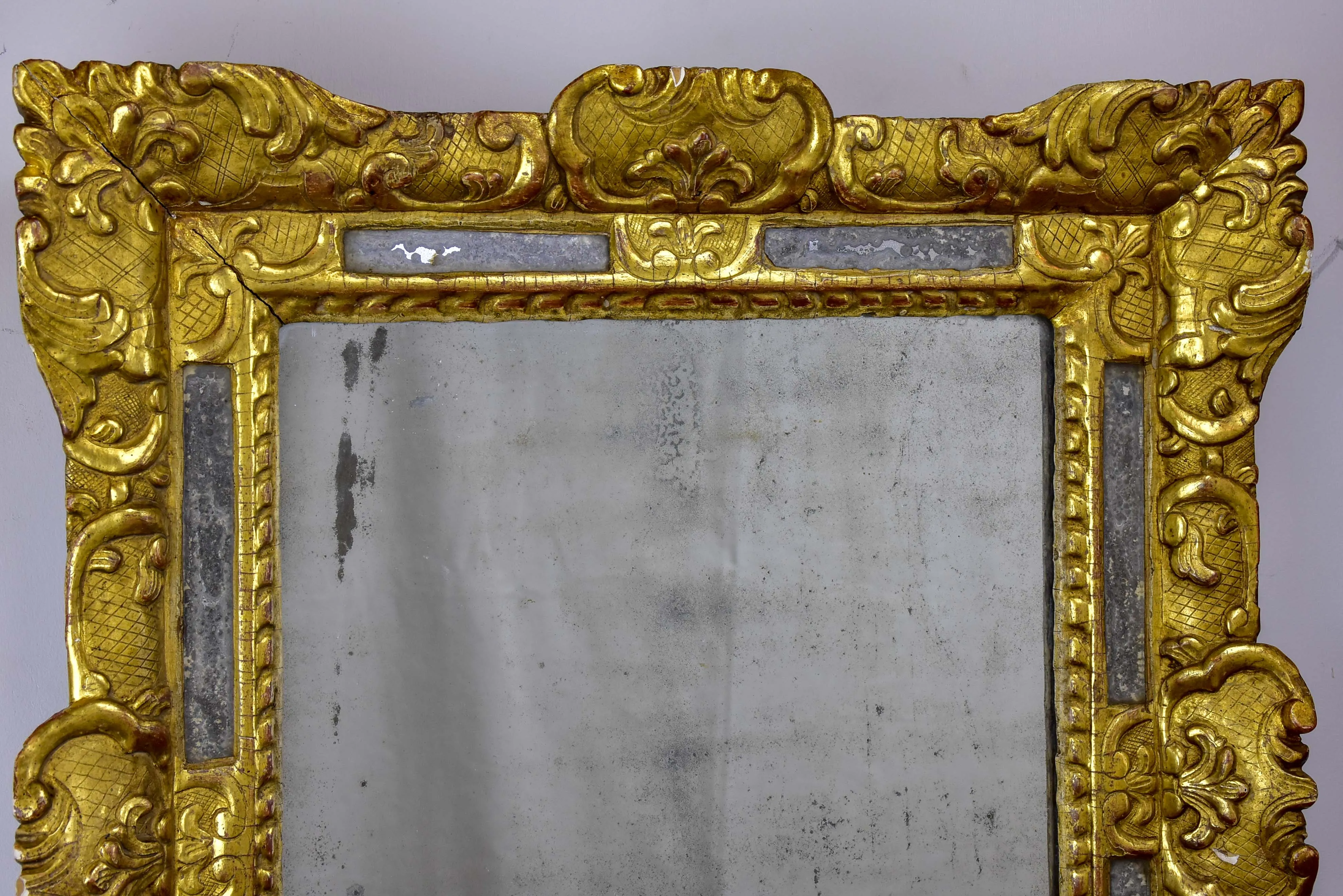 18th Century French mirror with gilded frame and aged glass 26” x 22 ½''