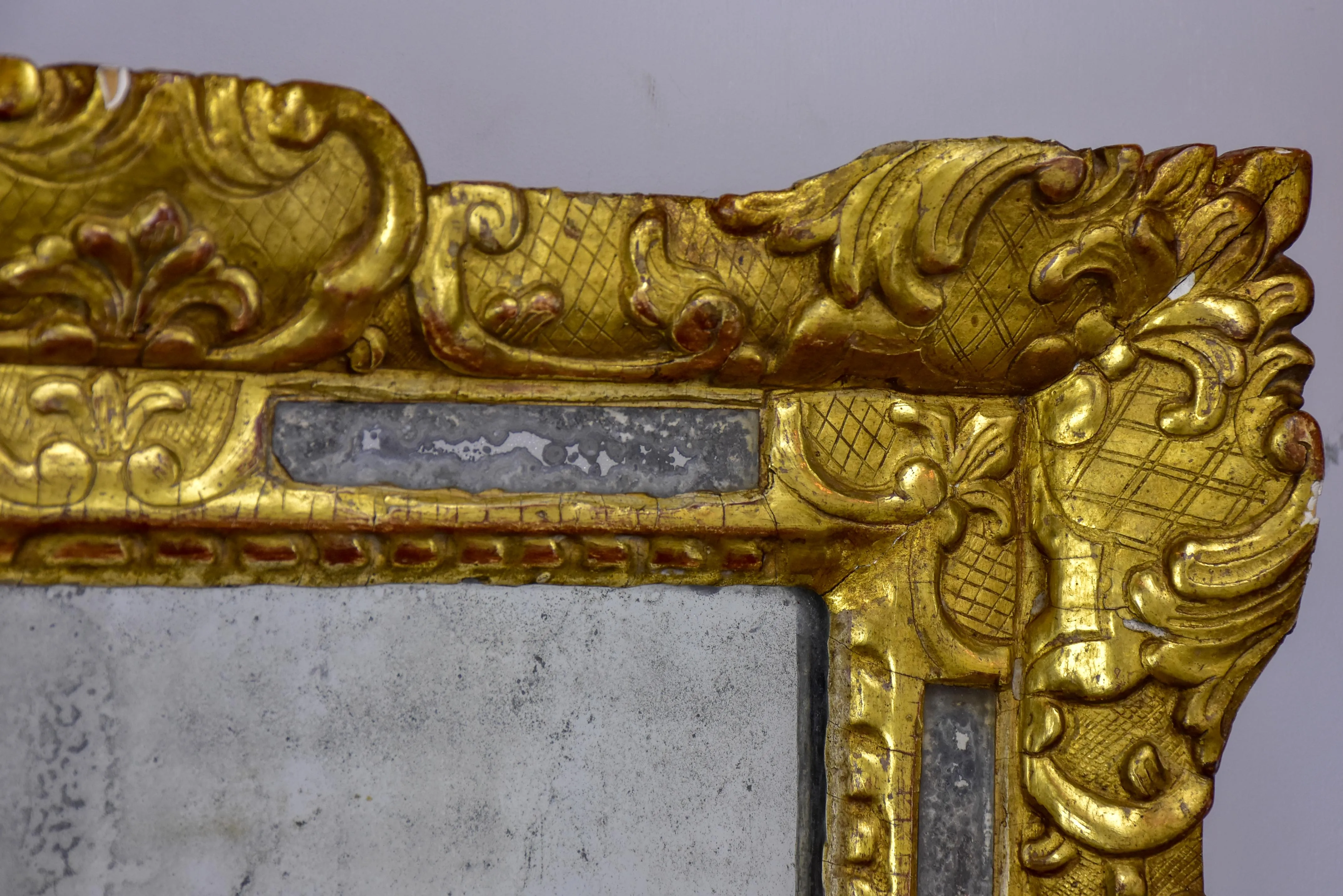 18th Century French mirror with gilded frame and aged glass 26” x 22 ½''