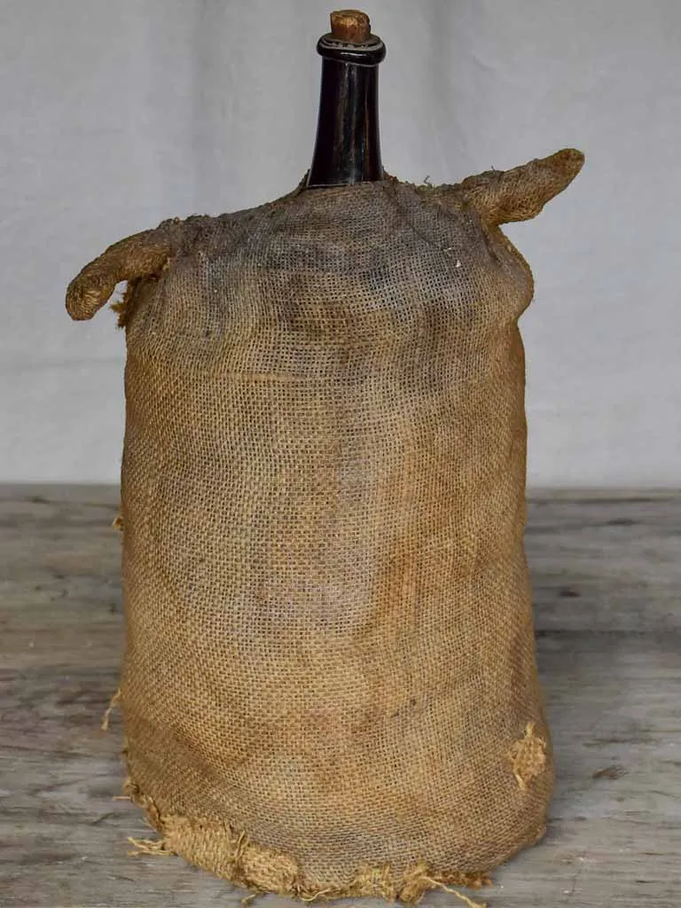 Antique French carboy in jute