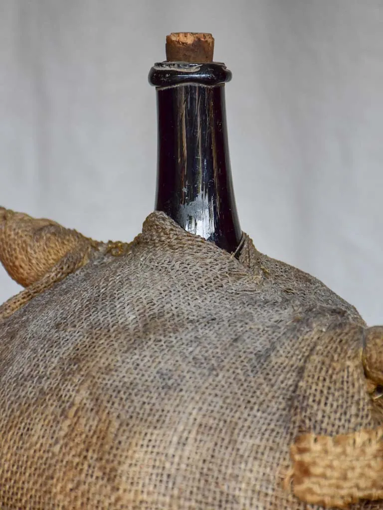 Antique French carboy in jute