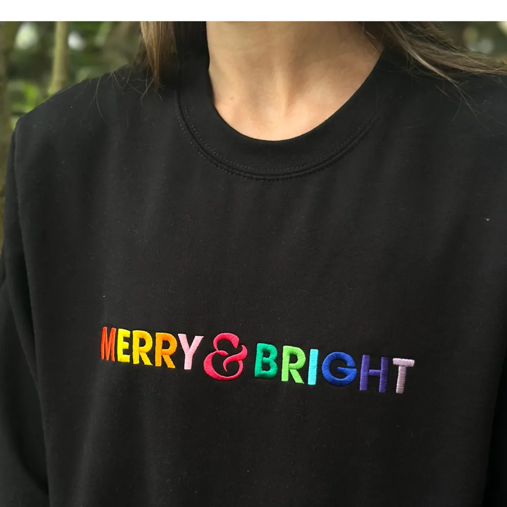 Merry & Bright Rainbow Embroidered Christmas Sweatshirt in Black